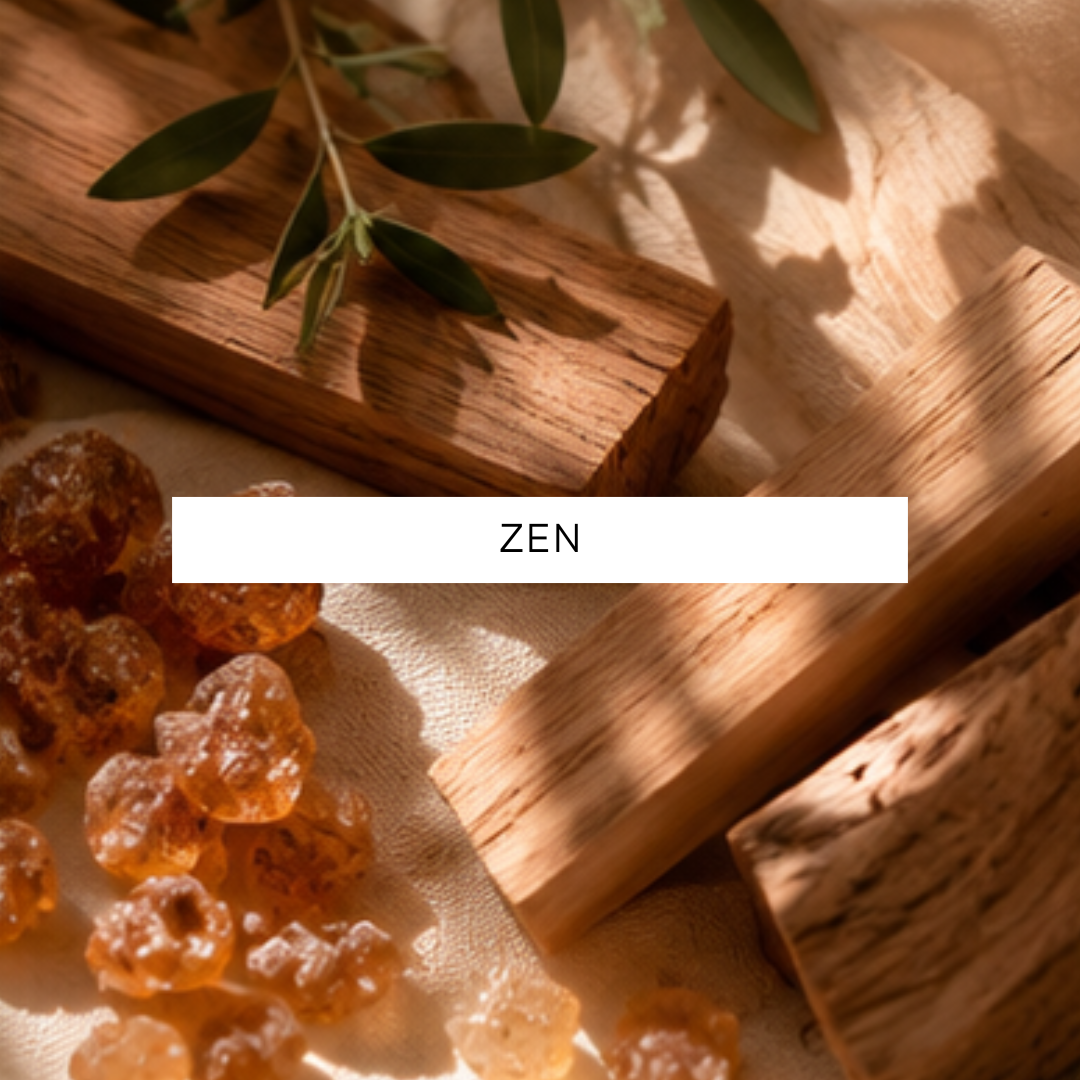 Wooden block, amber-colored stones, and olive branch on a textured surface with 'ZEN' text overlay.