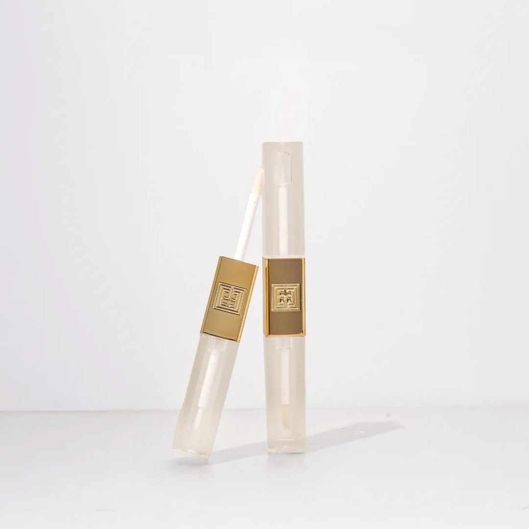 Two clear cylindrical products with gold accents on a white background